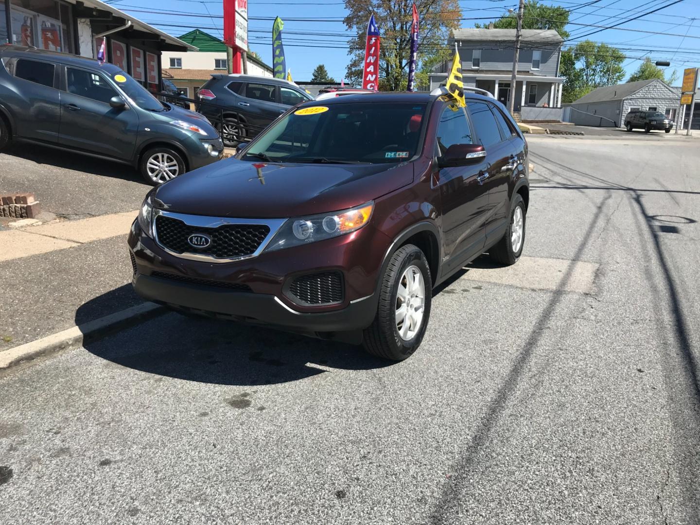 2012 Burgundy /Gray Kia Sorento LX (5XYKTDA29CG) with an 3.5 V6 engine, Automatic transmission, located at 577 Chester Pike, Prospect Park, PA, 19076, (610) 237-1015, 39.886154, -75.302338 - Photo#2